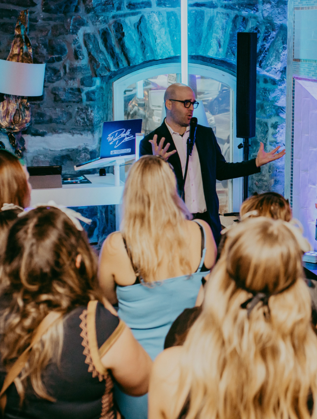 Michael Bourada performing a feature magic show at a wedding reception